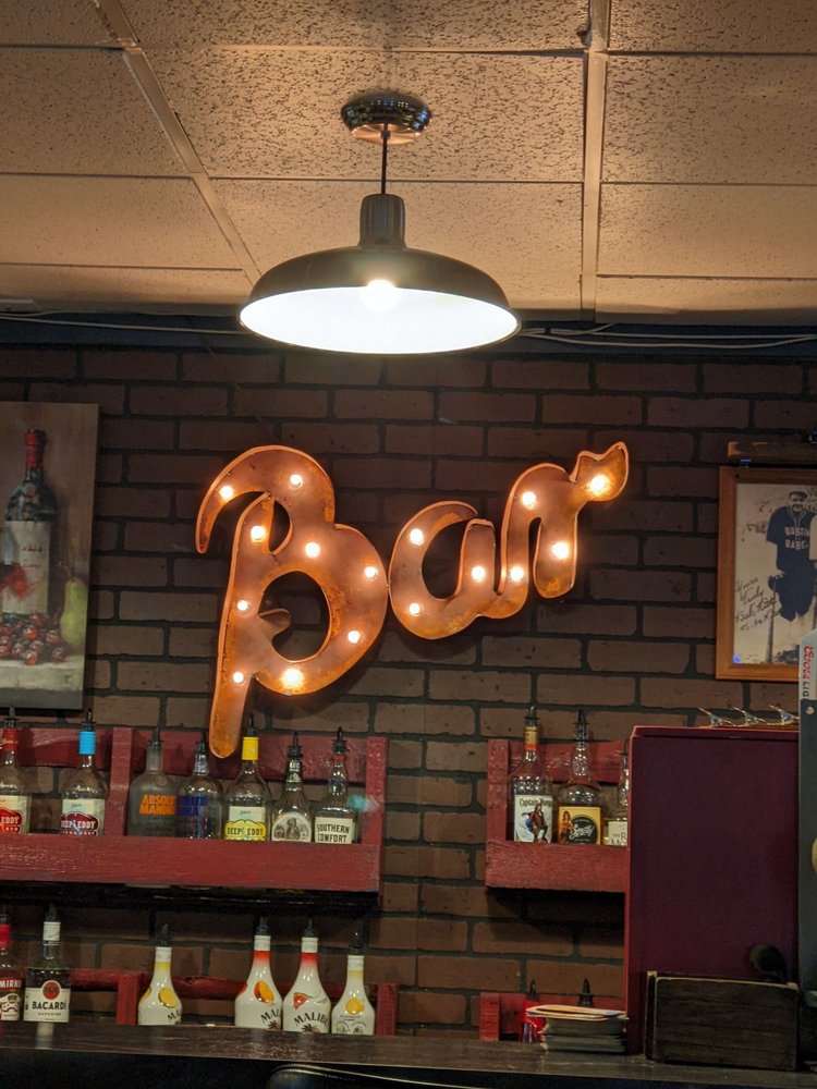 The Warehouse Sports Bar & Grill logo