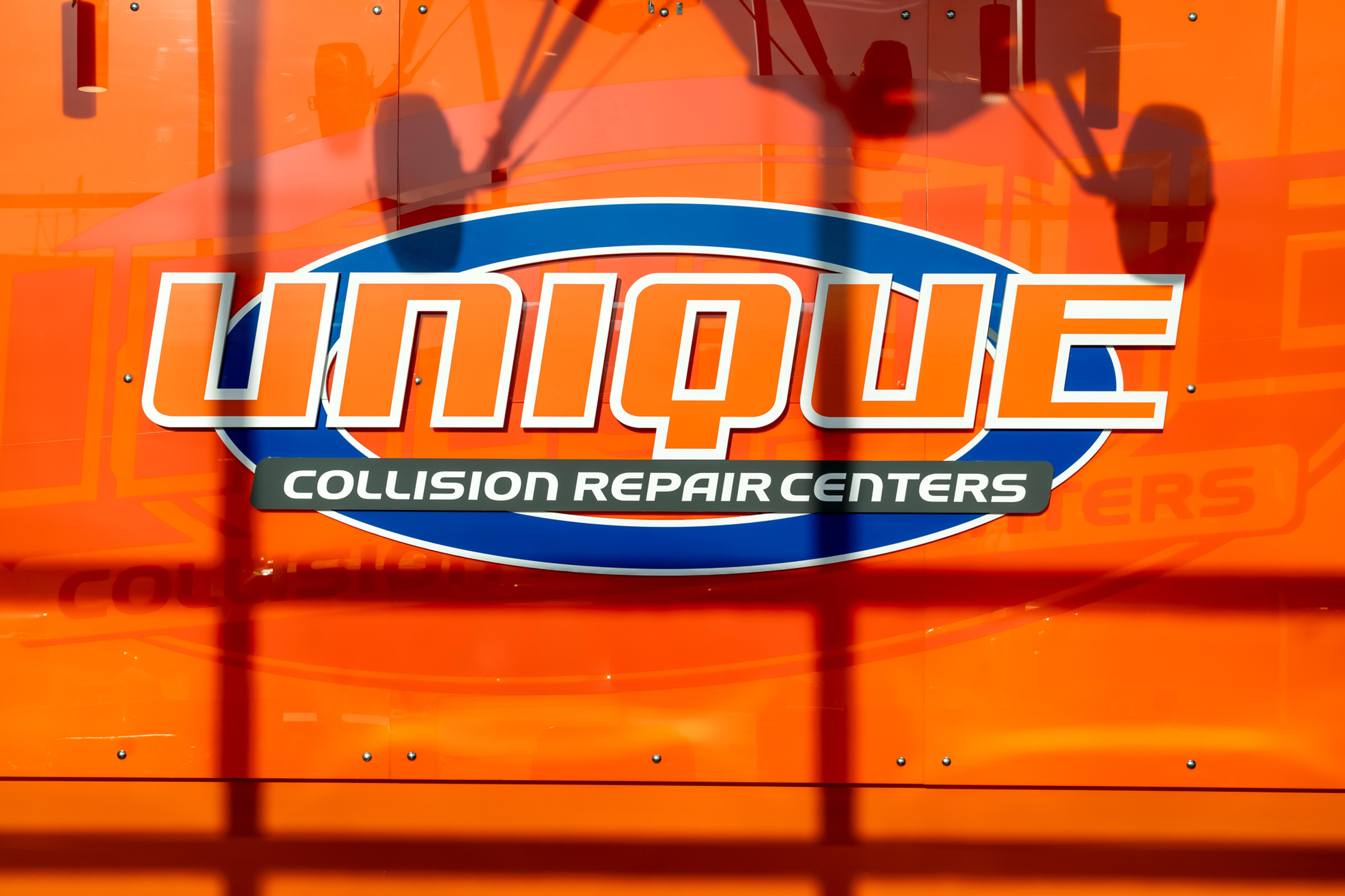 Unique Auto Body Midvale logo